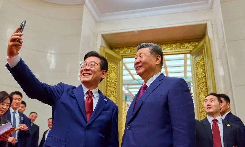 South Korea’s President Lee Jae Myung takes a selfie with his Chinese counterpart Xi Jinping after a dinner at the Great Hall of the People.—AFP South Korea’s President Lee Jae Myung takes a selfie with his Chinese counterpart Xi Jinping after a dinner at the Great Hall of the People.—AFP