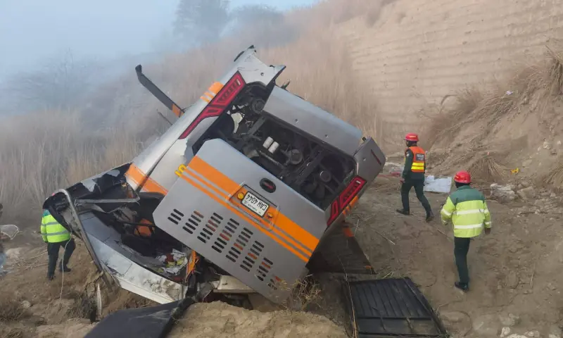 Rescue workers inspect the remains of a passenger bus that fell into a ravine near Talagang on January 7. &mdash; Photo via Nabeel Anwar Dhakku