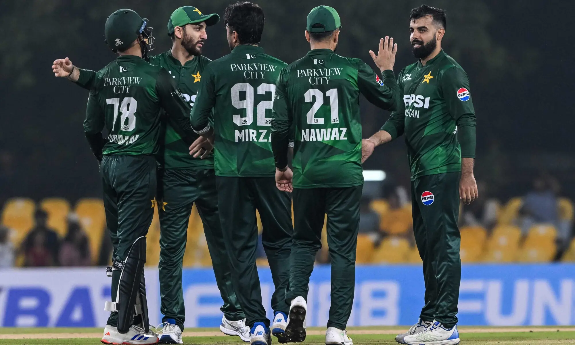 Pakistan spinner Shadab Khan (R) celebrates with team-mates after taking the wicket of Sri Lanka&rsquo;s Dhananjaya de Silva during the first Twenty20 International at the Rangiri Dambulla International Stadium in Dambulla on January 7, 2026.&mdash;AFP