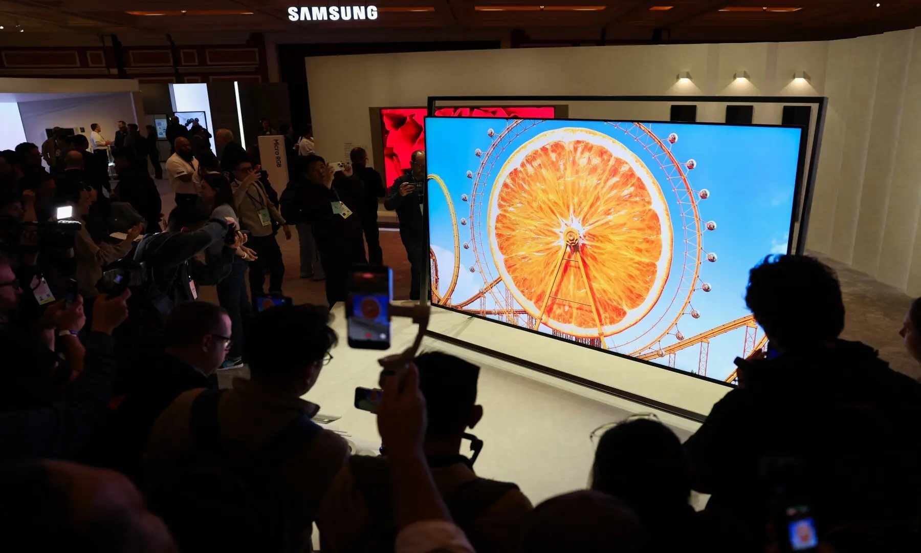 Attendees view the Samsung Micro RGB 130-inch TV after it was unveiled during the Samsung Electronics First Look event ahead of the Consumer Electronics Show (CES) in Las Vegas, Nevada on January 4, 2026. &mdash; Patrick T. Fallon / AFP