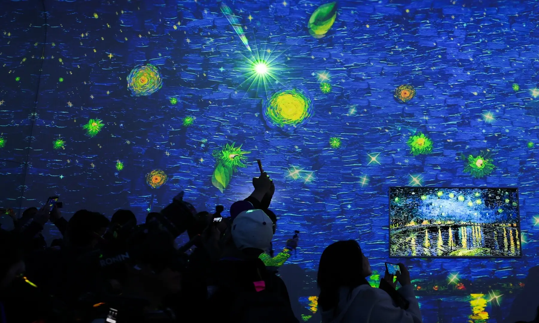 People take pictures of a projection as they enter the Samsung Electronics First Look event ahead of the Consumer Electronics Show (CES) in Las Vegas, Nevada on January 4, 2026. &mdash; Patrick T. Fallon / AFP