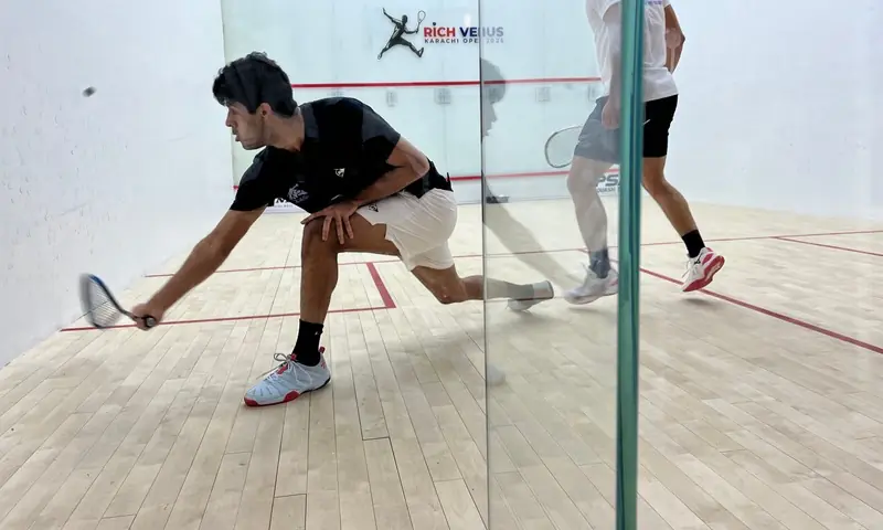 Noor Zaman plays a shot against Egypt&rsquo;s Fares Dessouky during the Round of 16 at the Karachi Open on Wednesday. &mdash; Photo by author