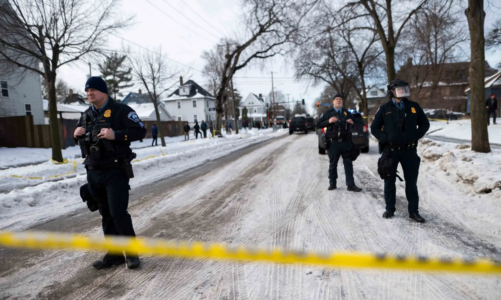 Minneapolis Police officers look on as members of law enforcement hold a perimeter around the scene of a shooting by an ICE agent during federal law enforcement operations on January 07, 2026 in Minneapolis, Minnesota. &mdash; AFP