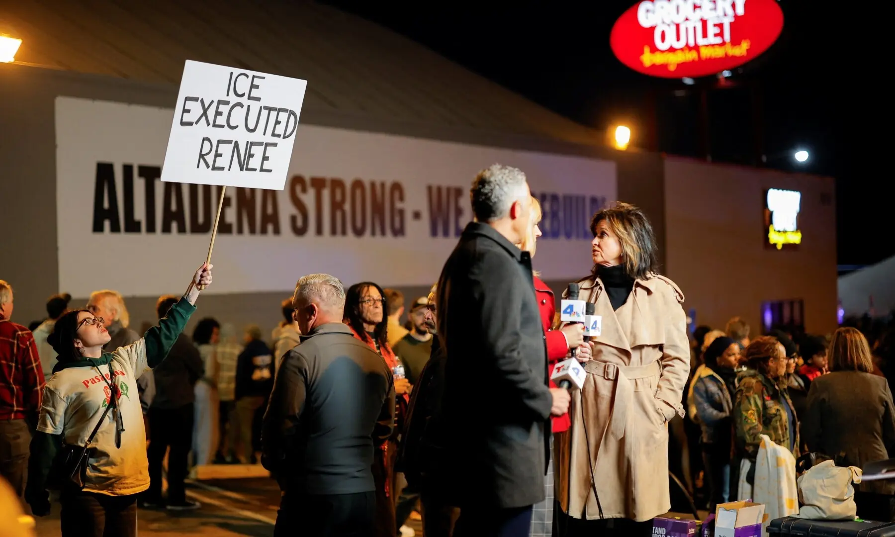 A person holds a sign following the death of Renee Nicole Good, a 37-year-old woman who was shot in her car by a US immigration agent, in Altadena, California, US,, January 7, 2026. —Reuters
