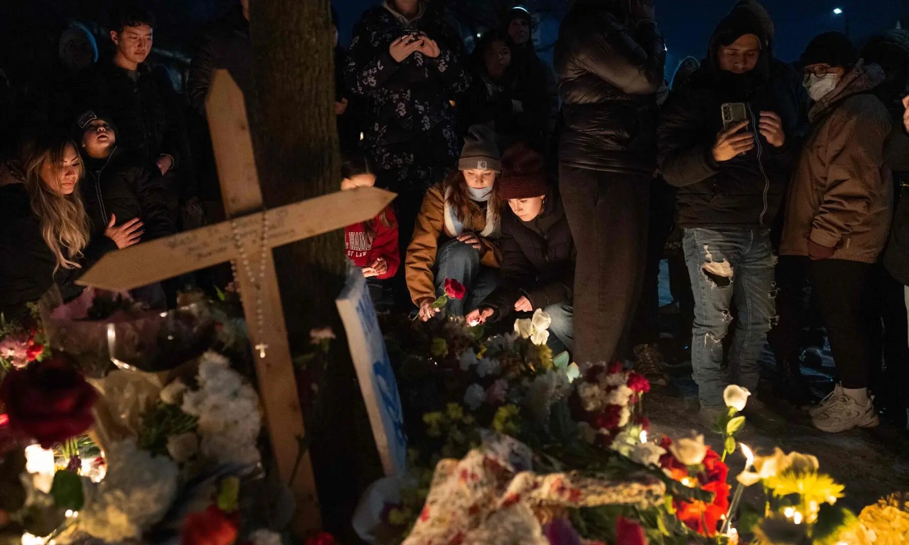 People visit a memorial for Renee Nicole Good on January 7, 2026 in Minneapolis, Minnesota. —AFP