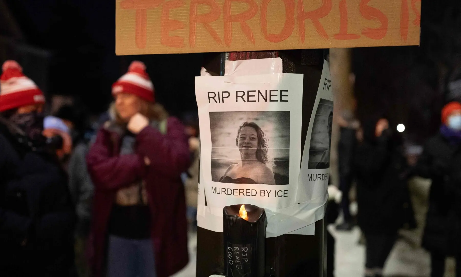 A notice reading “RIP Renee, murdered by ICE” is seen next to a memorial for Renee Nicole Good on January 7, 2026 in Minneapolis, Minnesota. —AFP