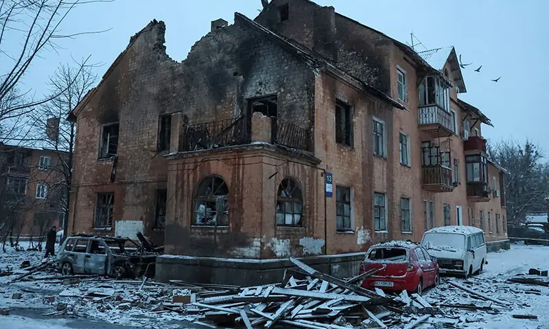 An apartment building is hit by a Russian drone strike in Kyiv, Ukraine on January 9. &mdash; Reuters