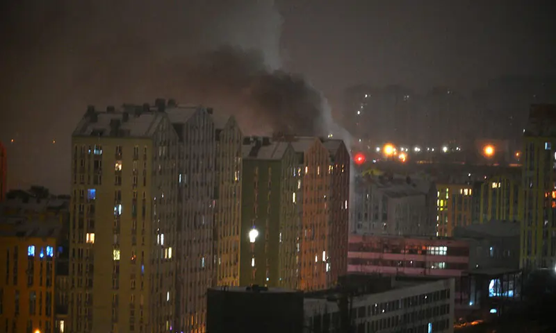 Smoke rises from a building after Russia launched an attack with drones and missiles on Kyiv, Ukraine on January 9. &mdash; AFP