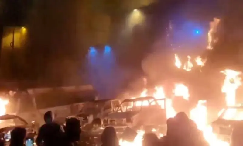 Protesters gather as vehicles burn, amid evolving anti-government unrest, in Tehran, Iran, in this screen grab obtained from a social media video released on January 9, 2026. &mdash;REUTERS