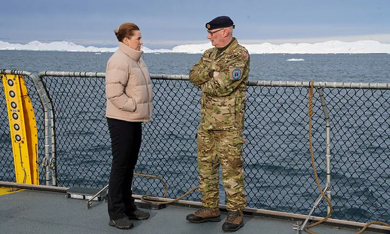 Denmark&rsquo;s Prime Minister Mette Frederiksen talks with the head of the Arctic Command Soeren Andersen, aboard the defence inspection vessel Vaedderen in the waters around Nuuk, Greenland on April 3, 2025. &mdash; Reuters/File