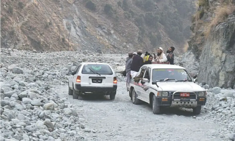 Commuters travel through the dilapidated Dubair Road, Lower Kohistan, on December 12, 2025. The 26km artery, which has deteriorated into a rough and dangerous track, was washed away in 2022 flash flood making travel for residents of dozens of villages an uphill task. &mdash; Photo by Nisar Ahmad Khan
