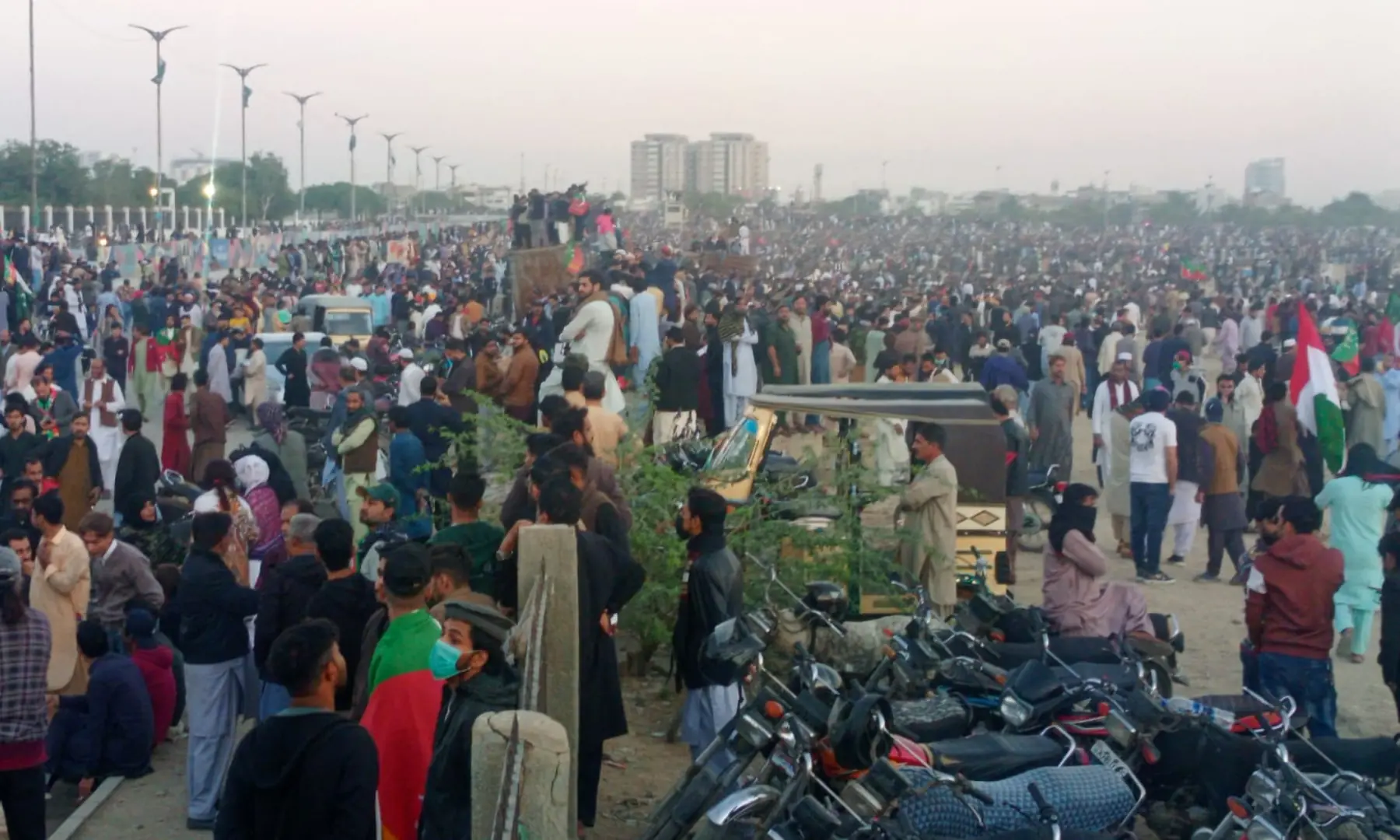 PTI workers gather near Mazar-i-Quaid ahead of the party&rsquo;s rally, in Karachi on Jan 11, 2026. &mdash; Shakil Adil/ White Star