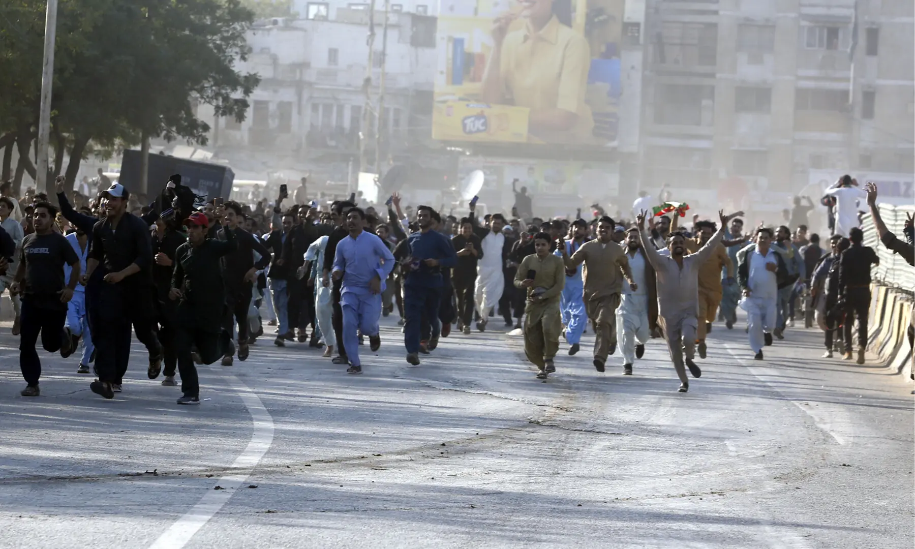 PTI supporters make their way towards Bagh-i-Jinnah from Numaish Chowrangi, on Jan 11, 2026. &mdash; Shakil Adil/ White Star