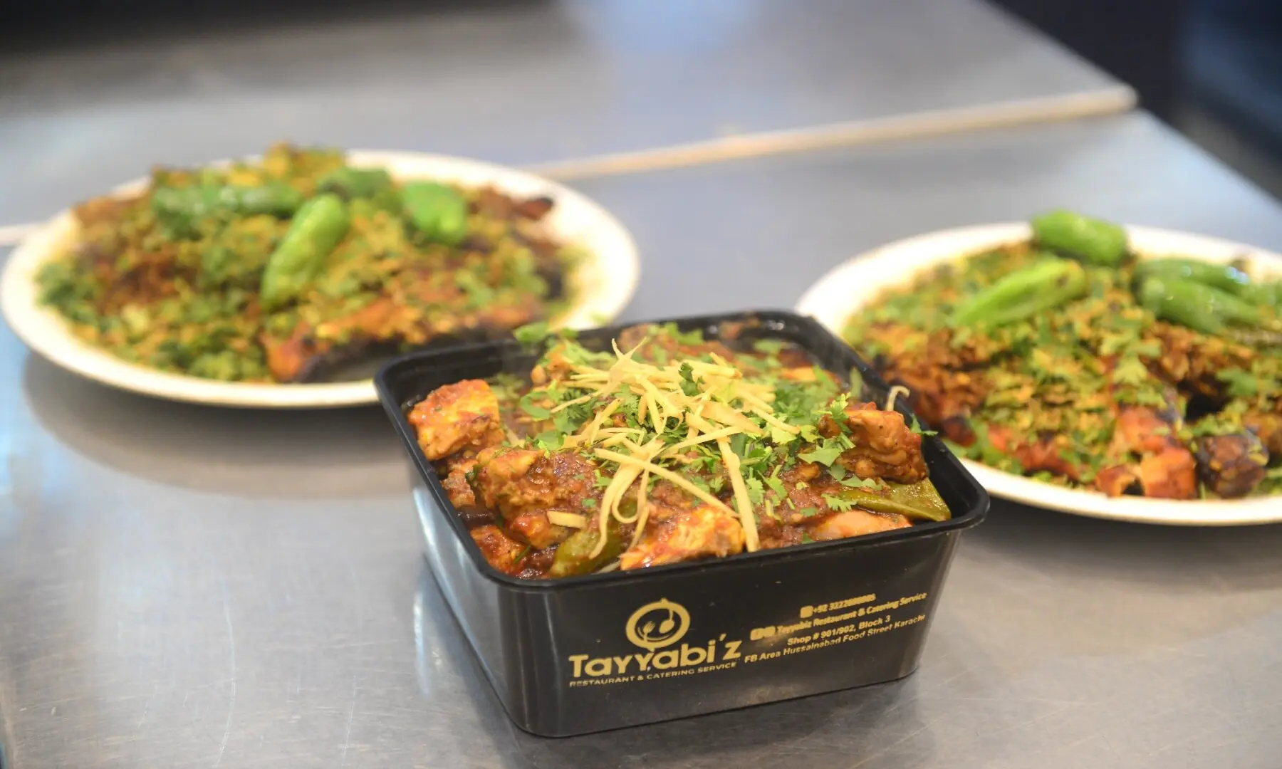 Chicken karhai with julienned ginger garnish, and tikka served with fresh coriander at a restaurant in Hussainabad, showcasing the rich variety of flavours Karachi&rsquo;s food streets have to offer. &mdash; Tahir Jamal/White Star