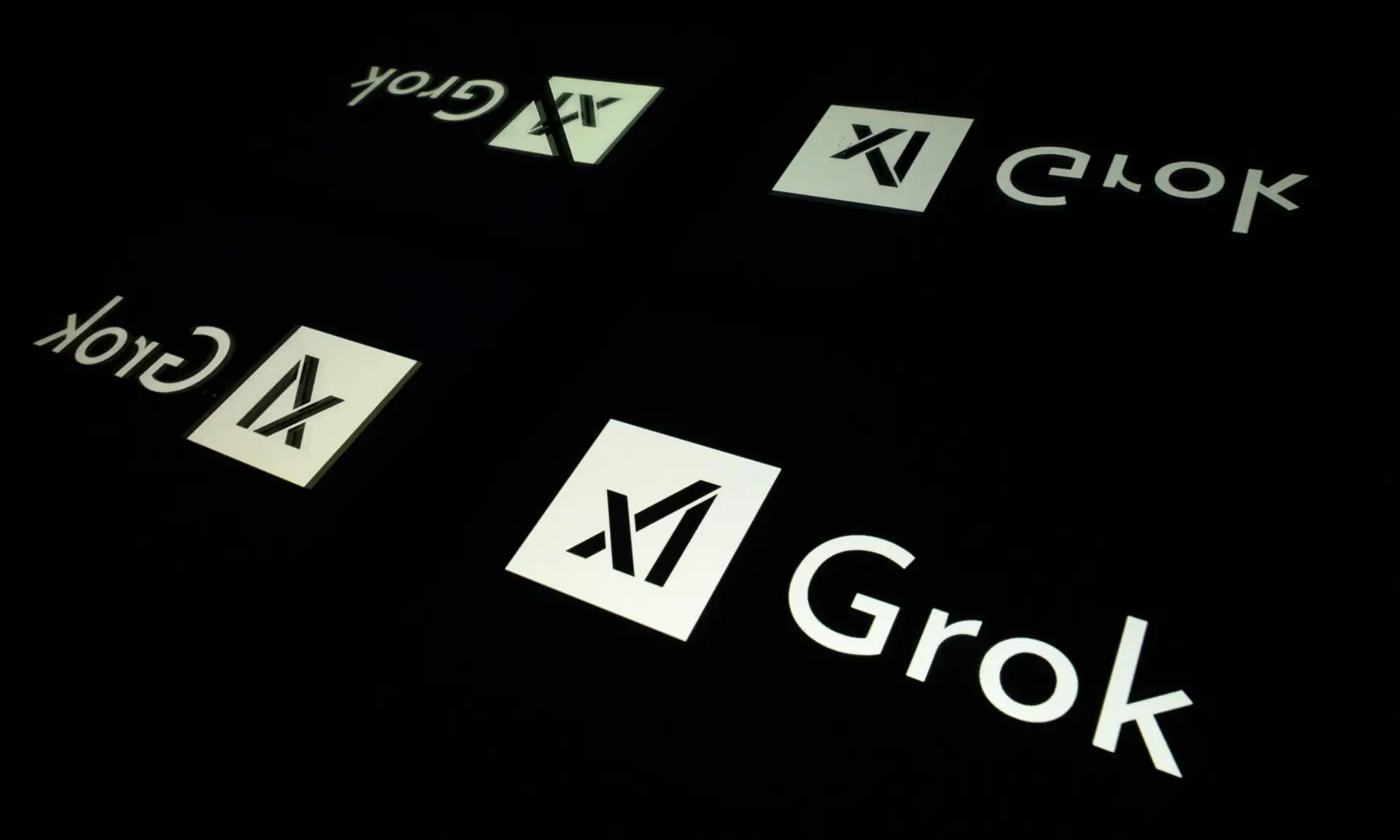 This photograph shows screens displaying the logo of Grok, a generative artificial intelligence chatbot developed by US artificial intelligence company xAI, in Toulouse, southern France, on Jan 15, 2025. &mdash; AFP/File