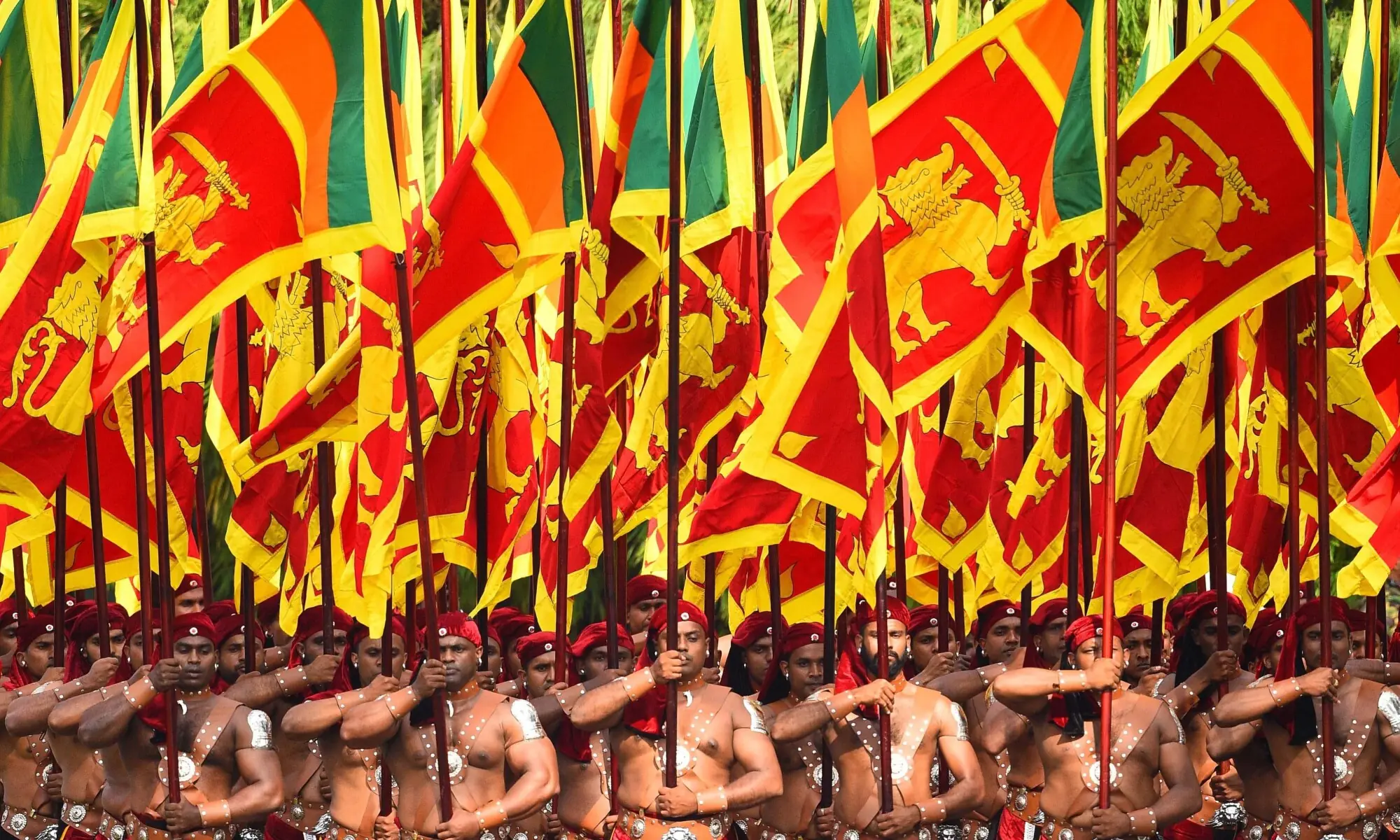 Sri Lankan military personnel march in their traditional dress holding national flags during the country&rsquo;s 72nd Independence Day celebrations in Colombo in this undated image. &mdash; AFP/File