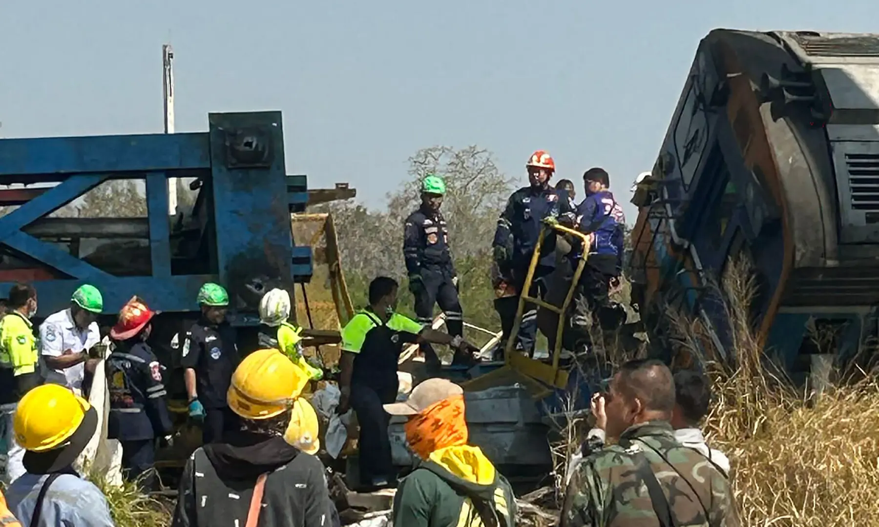 This UGC handout photo courtesy of Facebook user Smith Mikle taken and released on January 14, 2026 shows rescue workers next to the wreckage of a train crash after a construction crane collapse in Thailand&rsquo;s Nakhon Ratchasima province. &mdash; AFP