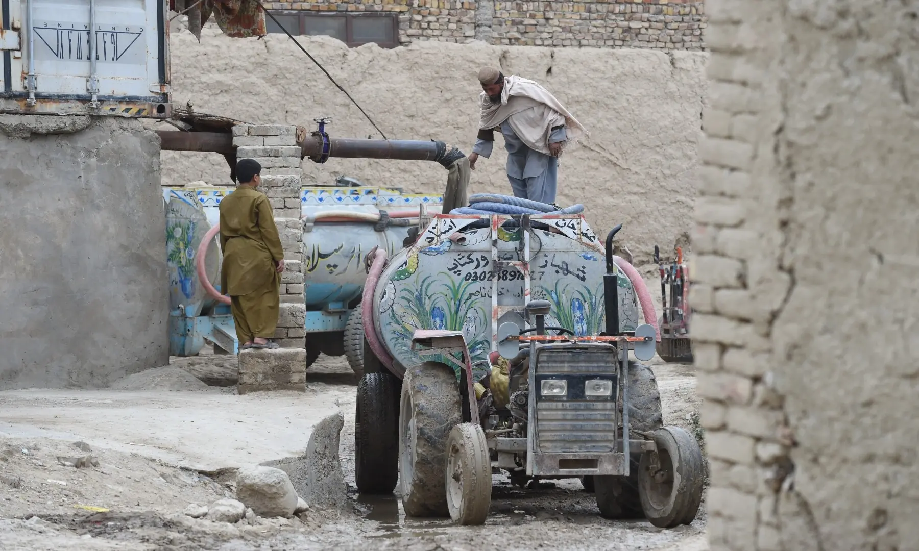 A water tanker awaits outside a house in Quetta for residents to collect water.  &mdash; Banaras Khan Yousafzai