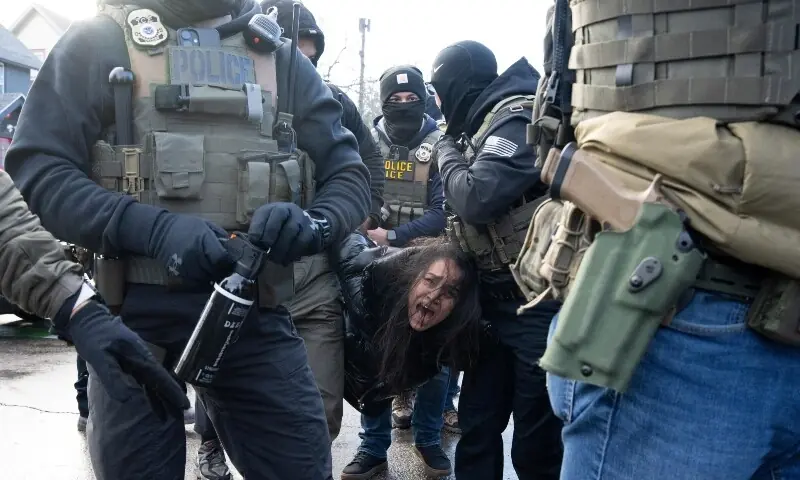 A detained woman is carried by federal agents after being pulled from her vehicle following an immigration protest in Minneapolis, Minnesota, US, January 13. — Reuters A detained woman is carried by federal agents after being pulled from her vehicle following an immigration protest in Minneapolis, Minnesota, US, January 13. — Reuters