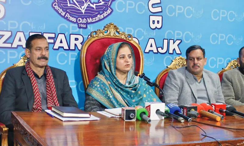 Academic Staff Association president Dr Rehana Kausar and Administrative Staff Association president Israr Saeed Qadri and others speak at a press conference on AJK University&rsquo;s fiscal crisis. &mdash; photo by author