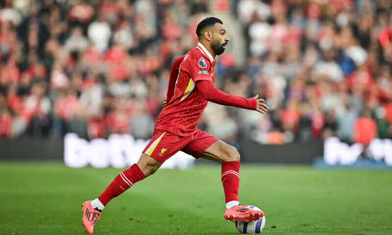 Liverpool&rsquo;s Egyptian striker #11 Mohamed Salah controls the ball during the English Premier League football match between Brighton and Hove Albion and Liverpool at the American Express Community Stadium in Brighton, southern England on May 19, 2025. &mdash; AFP