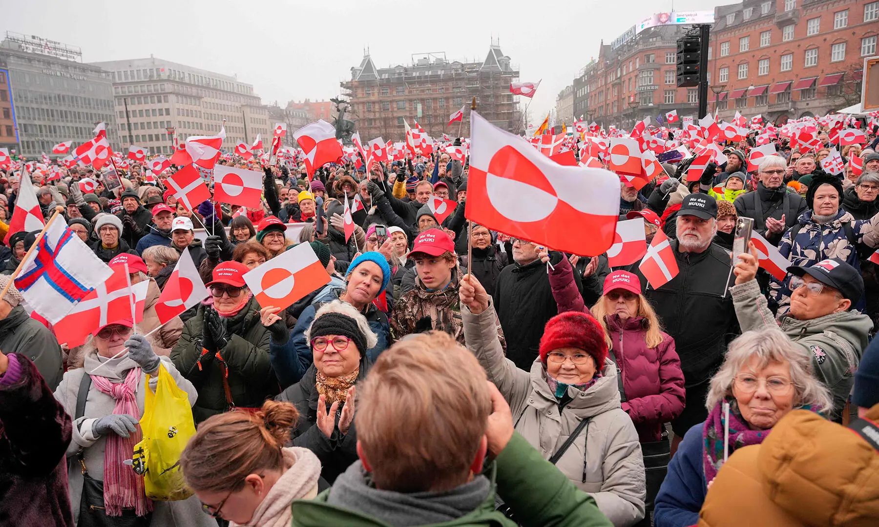 Protesters wave Greenlandic flags as they take part in a rally under the slogans ‘Hands off Greenland’ and ‘Greenland for Greenlanders’, in front of the City Hall in Copenhagen, Denmark on January 17. — AFP
