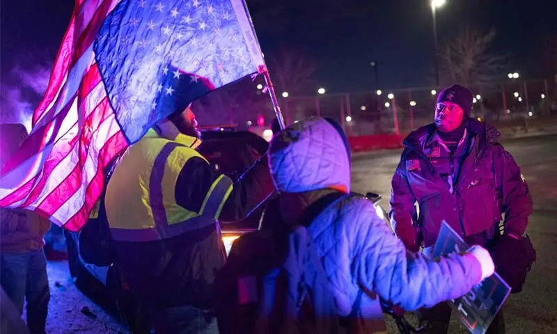 Sheriffs confront anti-ICE demonstrators protesting outside of the Whipple federal building on January 17, 2026 in Minneapolis, Minnesota. &mdash; AFP
