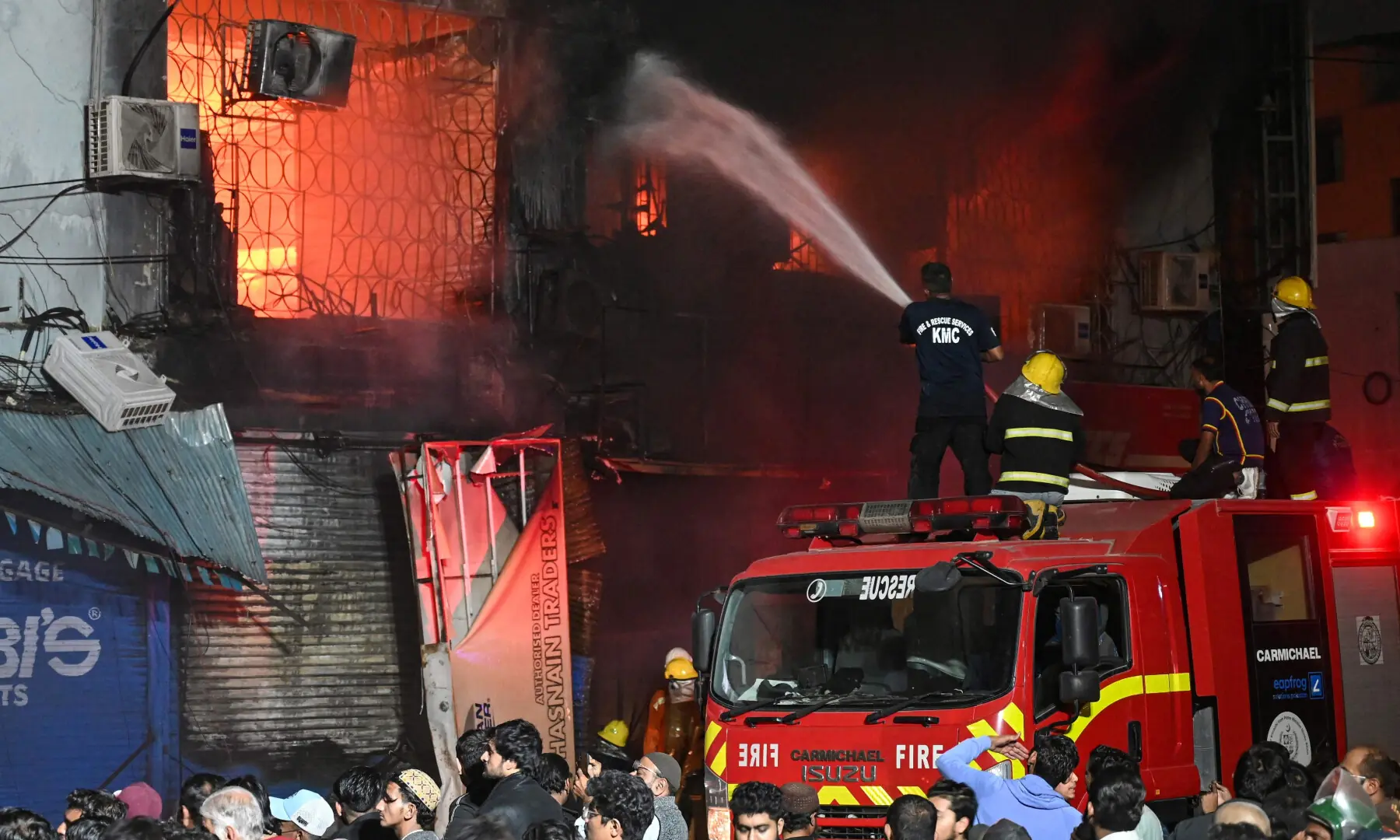 Firefighters douse a fire that broke out at a shopping mall in Karachi on Jan 18, 2026. — AFP Firefighters douse a fire that broke out at a shopping mall in Karachi on Jan 18, 2026. — AFP