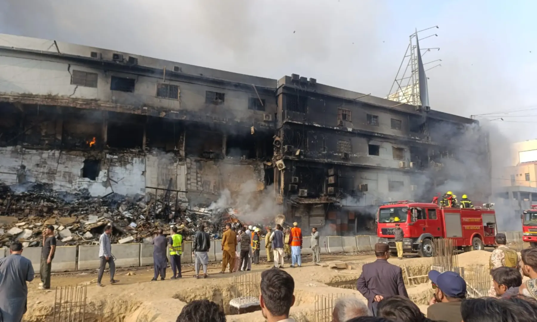 A portion of Gul Plaza shopping mall stands damaged as as smoke rises from a fire ongoing since the last night, on MA Jinnah Road, Karachi on Jan 18, 2026. — Hassan Belal Zaidi A portion of Gul Plaza shopping mall stands damaged as as smoke rises from a fire ongoing since the last night, on MA Jinnah Road, Karachi on Jan 18, 2026. — Hassan Belal Zaidi