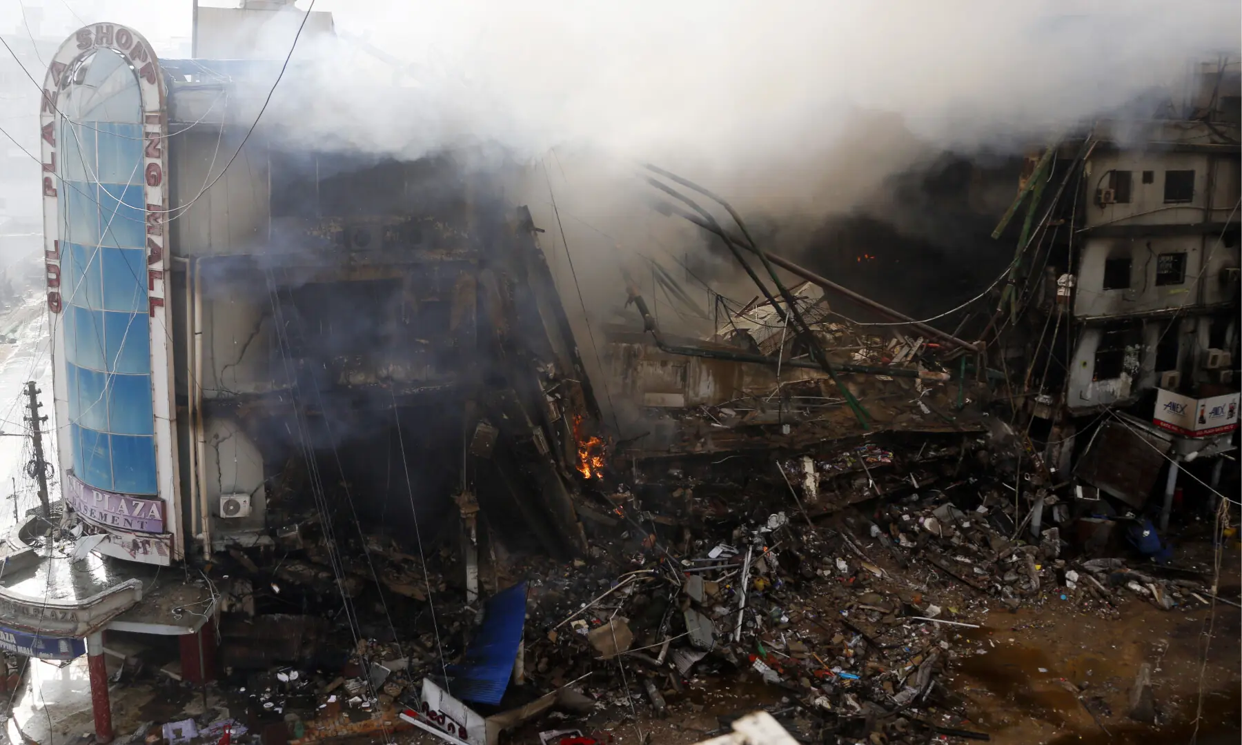 Firefighters and rescue workers make efforts to douse a fire at the Gul Plaza shopping mall on Karachi’s MA Jinnah Road on Jan 18, 2026. — Shakil Adil/White Star