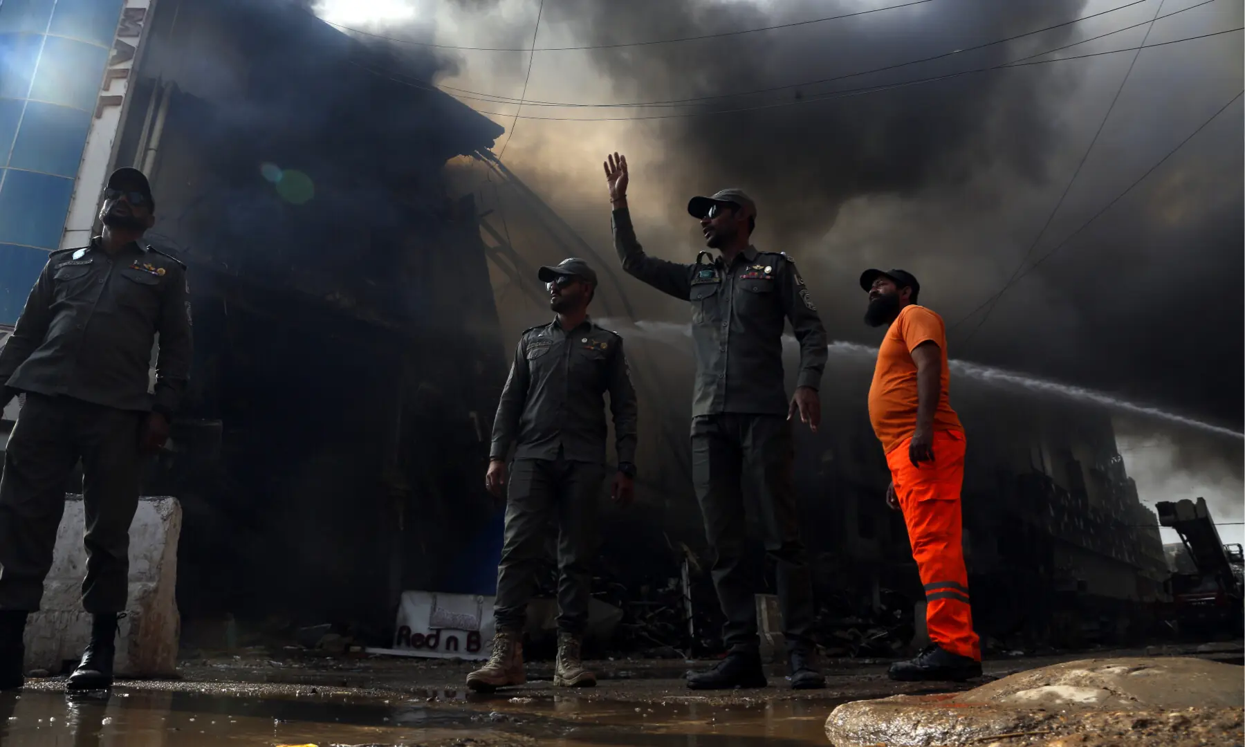 Firefighters and rescue workers make efforts to douse a fire at the Gul Plaza shopping mall on Karachi’s MA Jinnah Road on Jan 18, 2026. — Shakil Adil/White Star