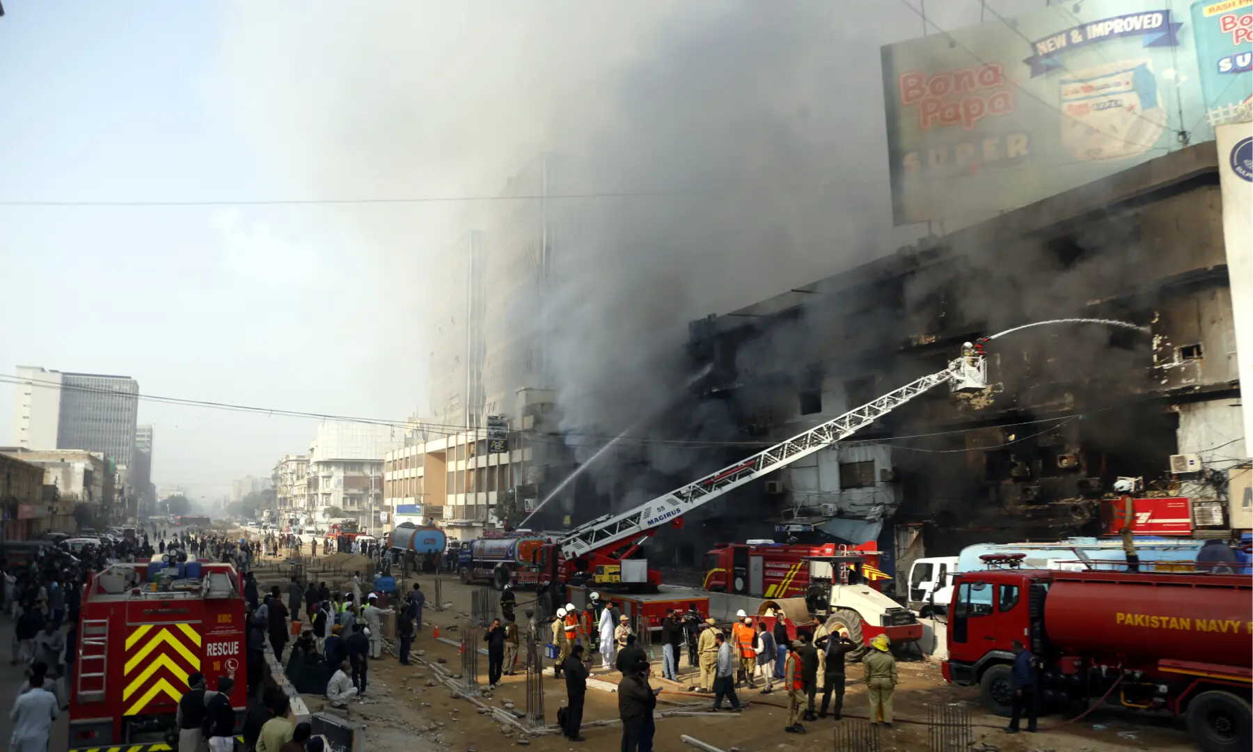 Firefighters and rescue workers make efforts to douse a fire at the Gul Plaza shopping mall on Karachi’s MA Jinnah Road on Jan 18, 2026. — Shakil Adil/White Star