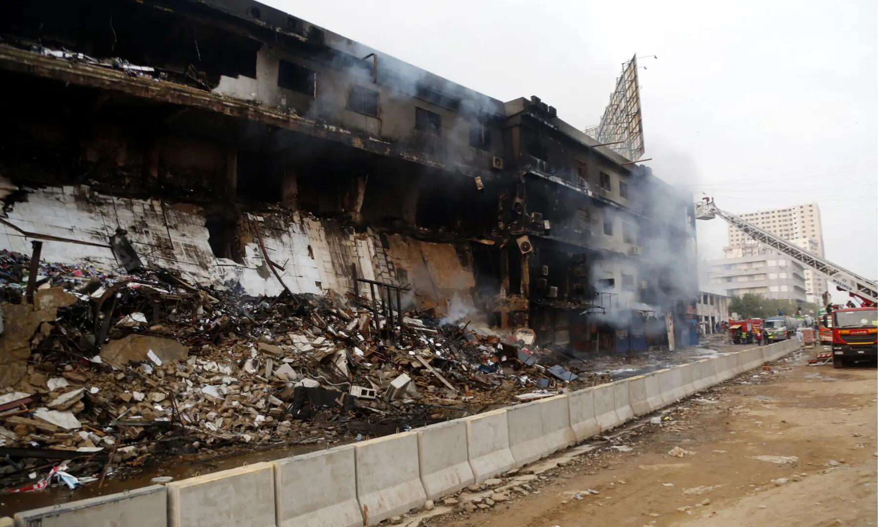 Shops at Karachi’s Gul Plaza shopping mall are reduced to rubble after a blaze erupted the previous night, on Jan 18, 2026. — Shakil Adil/White Star
