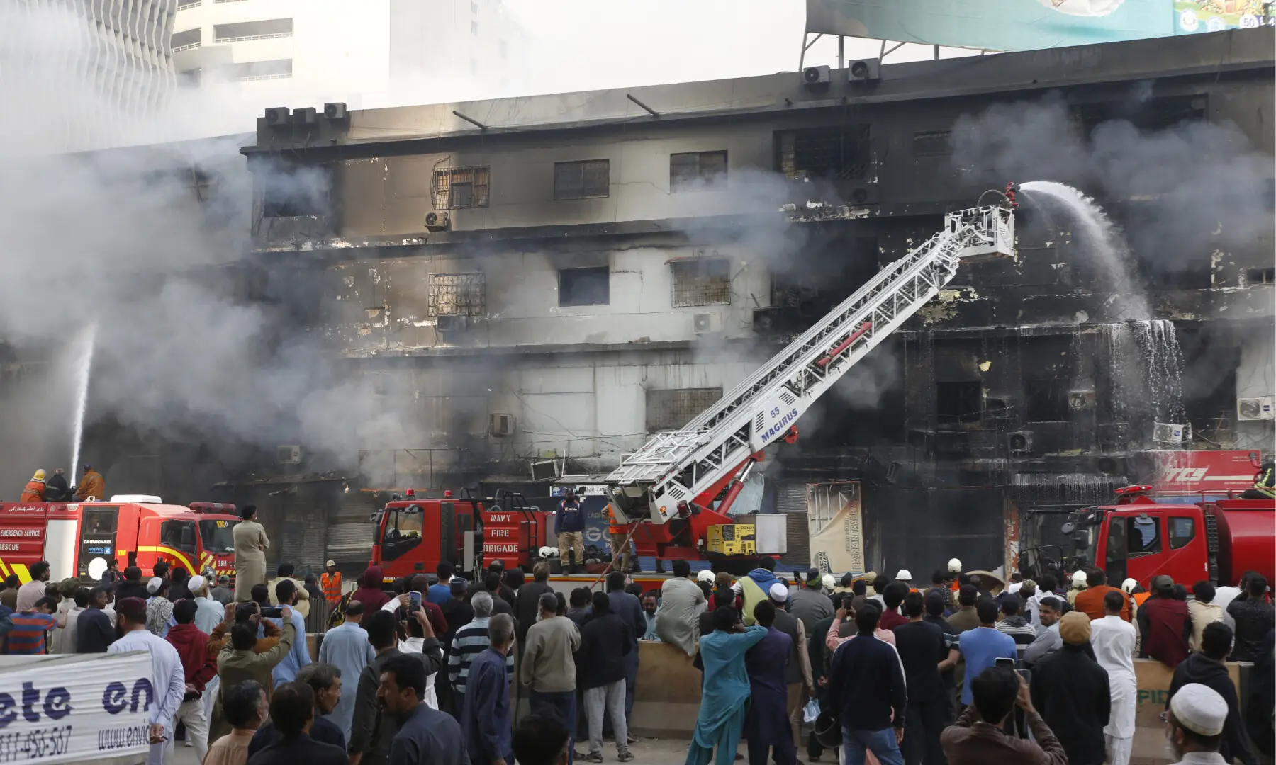 Firefighters and rescue workers make efforts to douse a fire at the Gul Plaza shopping mall on Karachi’s MA Jinnah Road on Jan 18, 2026. — Shakil Adil/White Star