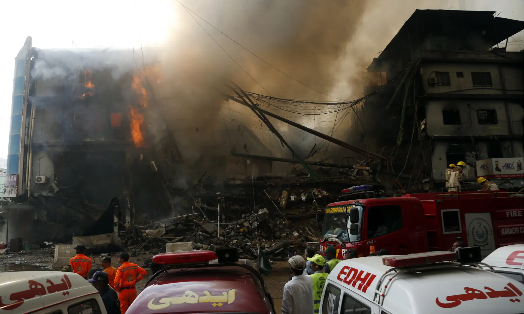 Firefighters and rescue workers make efforts to douse a fire at the Gul Plaza shopping mall on Karachi’s MA Jinnah Road on Jan 18, 2026. — Shakil Adil/White Star