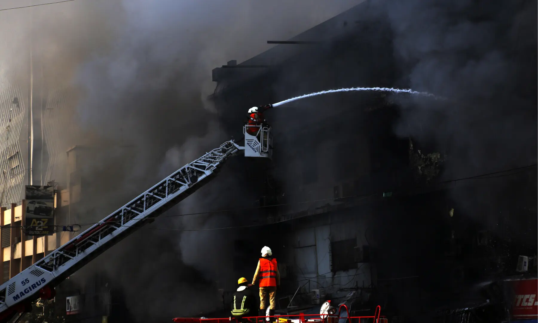 Firefighters and rescue workers make efforts to douse a fire at the Gul Plaza shopping mall on Karachi’s MA Jinnah Road on Jan 18, 2026. — Shakil Adil/White Star