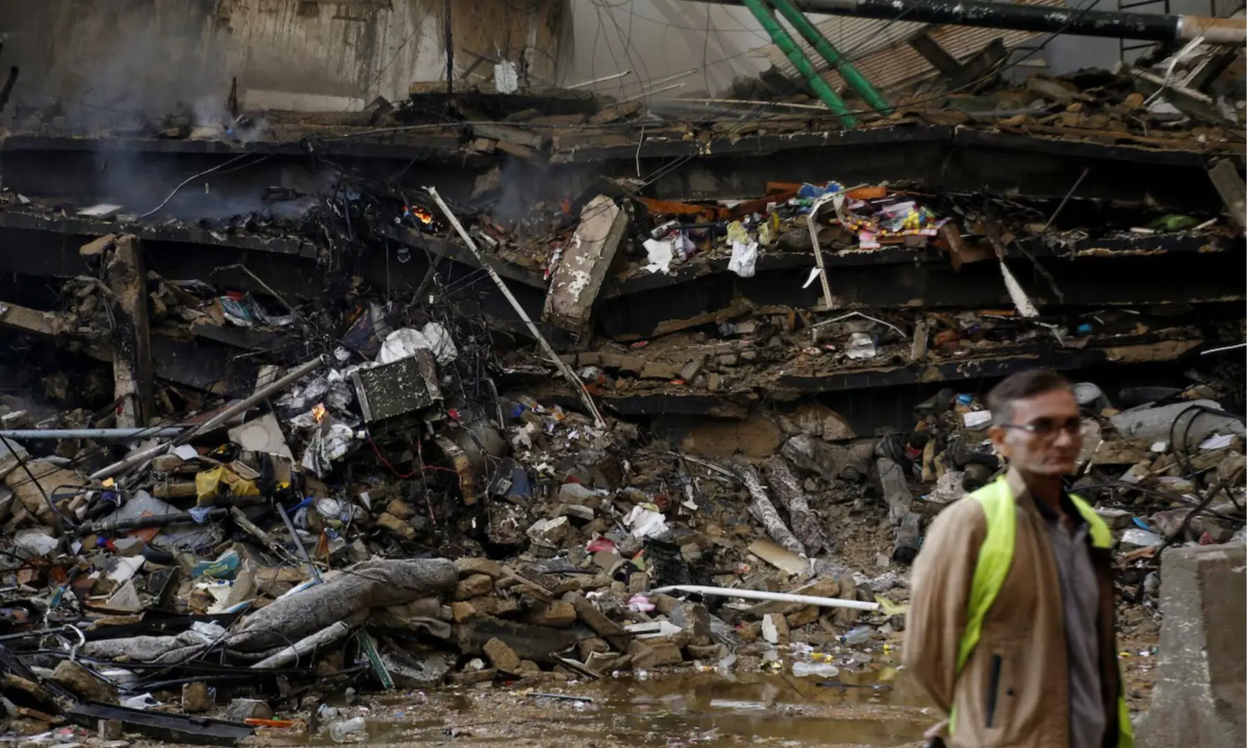 A portion of Karachi’s Gul Plaza shopping mall is reduced to rubble after a blaze erupted the previous night, on Jan 18, 2026. — Shakil Adil/White Star