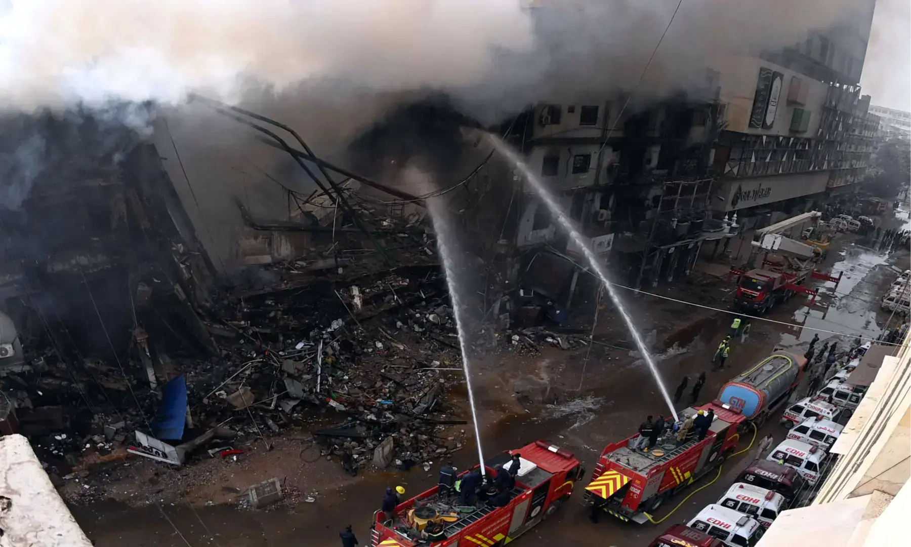 Firefighters and rescue workers make efforts to douse a fire at the Gul Plaza shopping mall on Karachi&rsquo;s MA Jinnah Road on Jan 18, 2026. &mdash; Shakil Adil/White Star