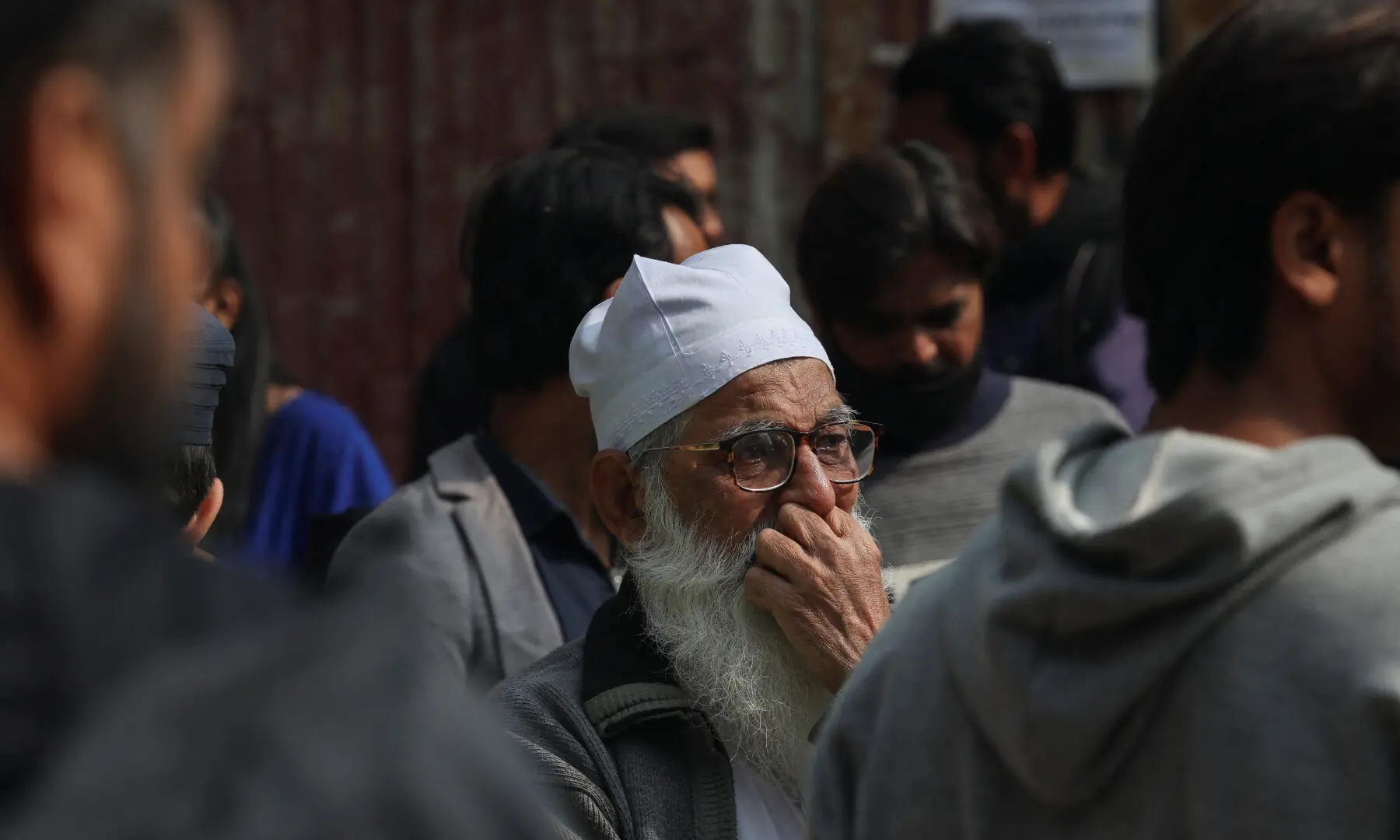 A man grieves after he lost his shop, following a massive fire at the Gul Plaza Shopping Centre in Karachi, on Jan 19, 2026. — Reuters