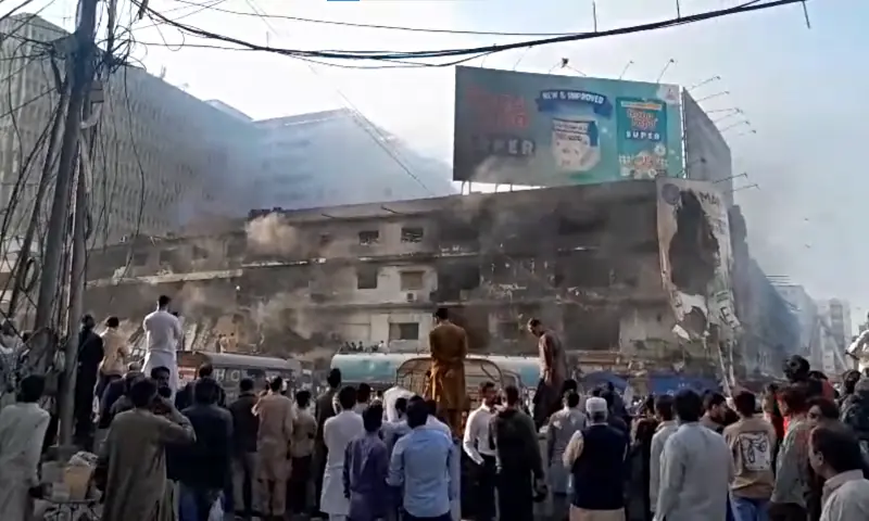 People gather as search operation is underway at Karachi&rsquo;s Gul Plaza shopping mall after a fire, on Jan 19, 2026. &mdash; screengrab from video by Imtiaz Ali