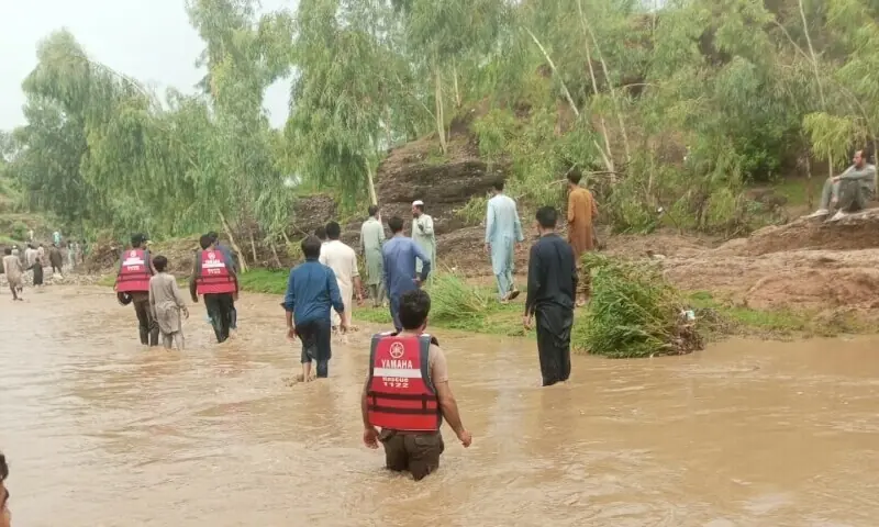 Rescuers participate in a search operation amid flash floods in Malakand on July 6. &mdash; Rescue 1122/ File