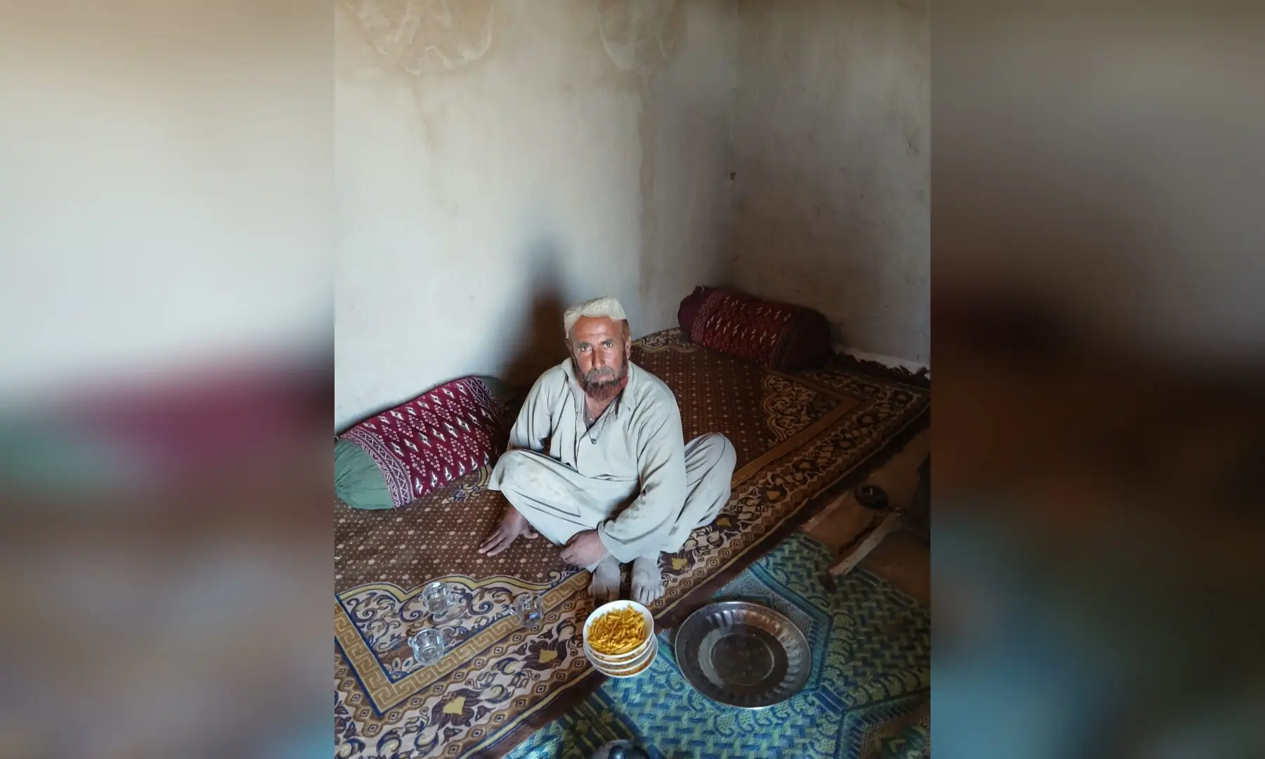 A villager sitting at his house in Sangeen village in Daak area of Nushki, which has been facing spells of droughts since 1997.