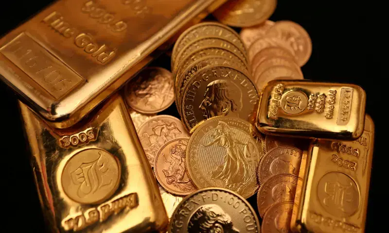 UK gold bars and gold Sovereign coins are displayed at Baird & Co in Hatton Garden in London, Britain on October 8, 2025. &mdash; Reuters/File