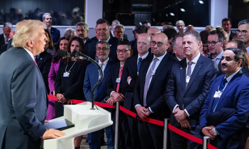 Business leaders listen to President Donald Trump during a reception at the World Economic Forum in Davos. &mdash; Reuters