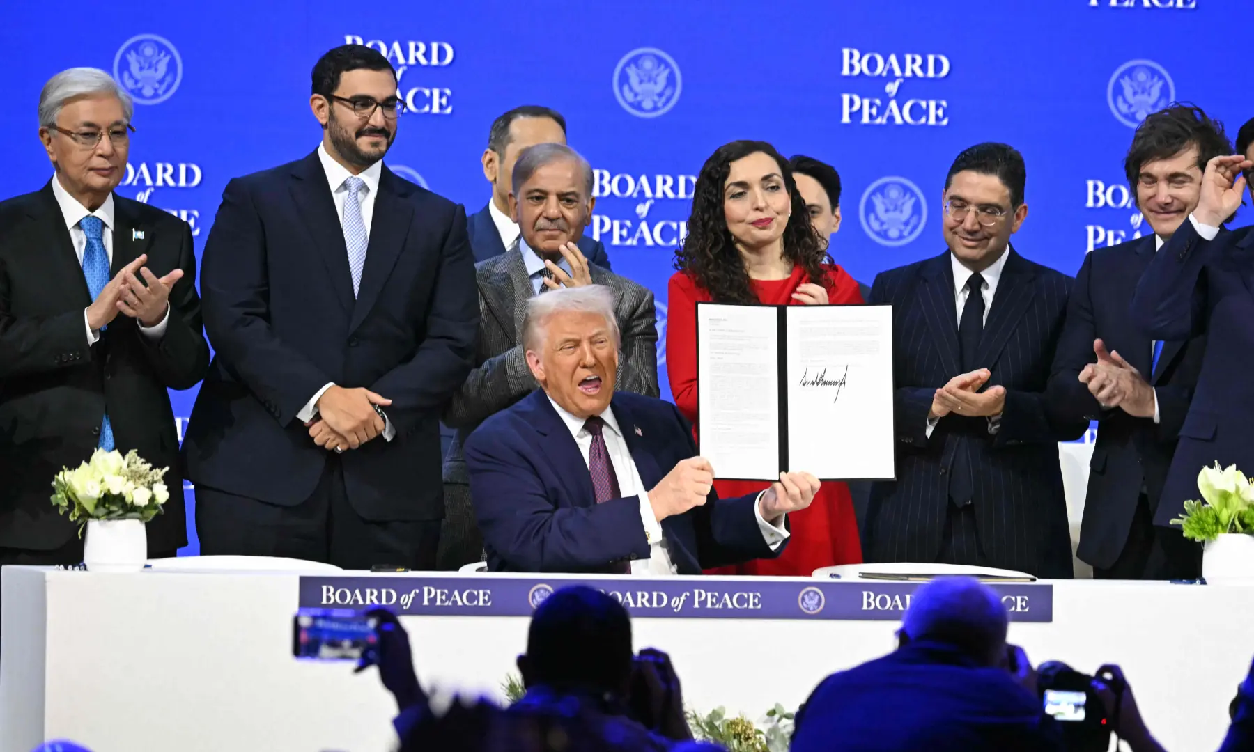 Prime Minister Shehbaz Sharif  and others applaud as US President Donald Trump holds a signing founding charter at the &ldquo;Board of Peace&rdquo; meeting during the World Economic Forum (WEF) annual meeting in Davos on Jan 22, 2026. &mdash; AFP