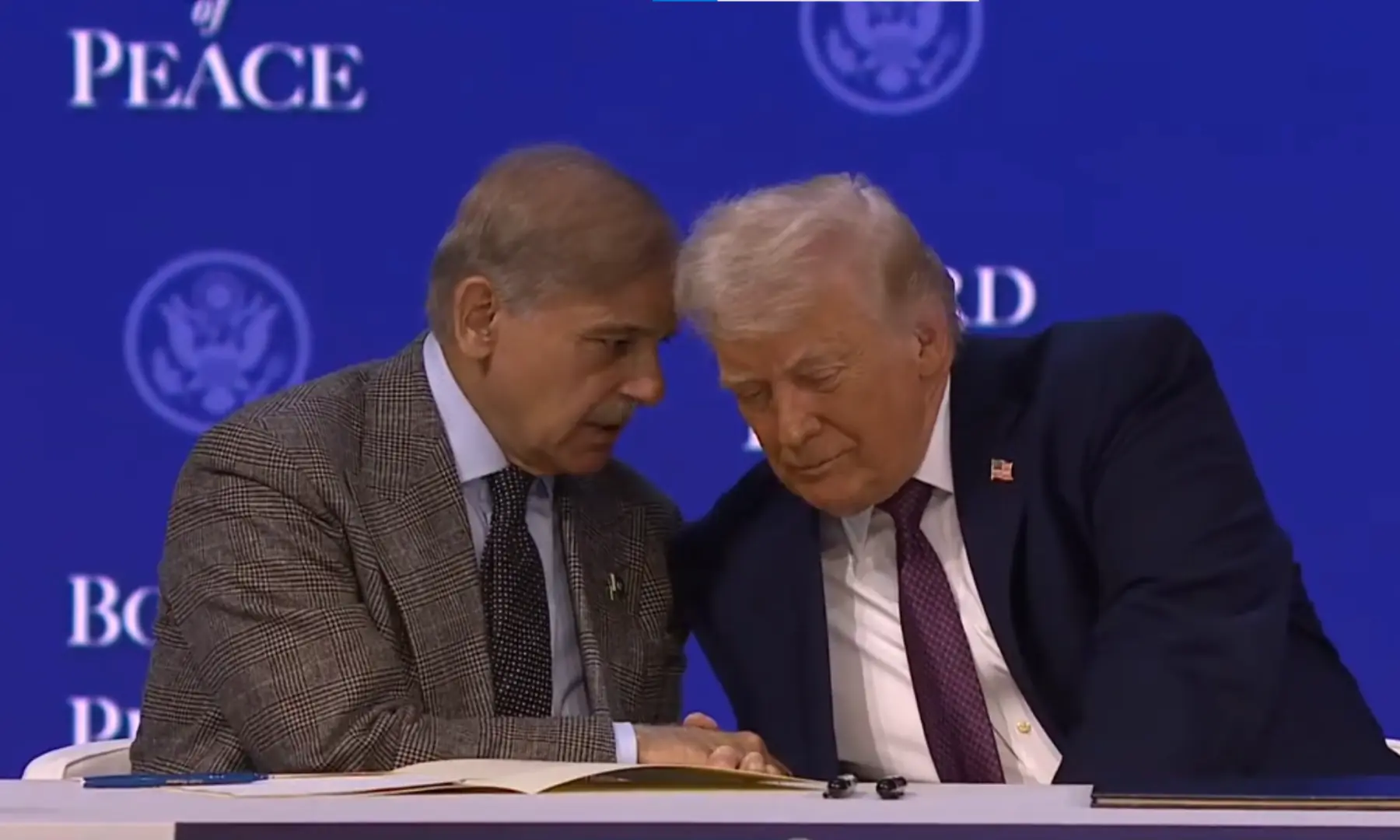 US President Donald Trump and PM Shehbaz Sharif speak at the signing ceremony of the Board of Peace in Davos on January 22, 2026. &mdash; screengrab via White House&rsquo;s YouTube channel