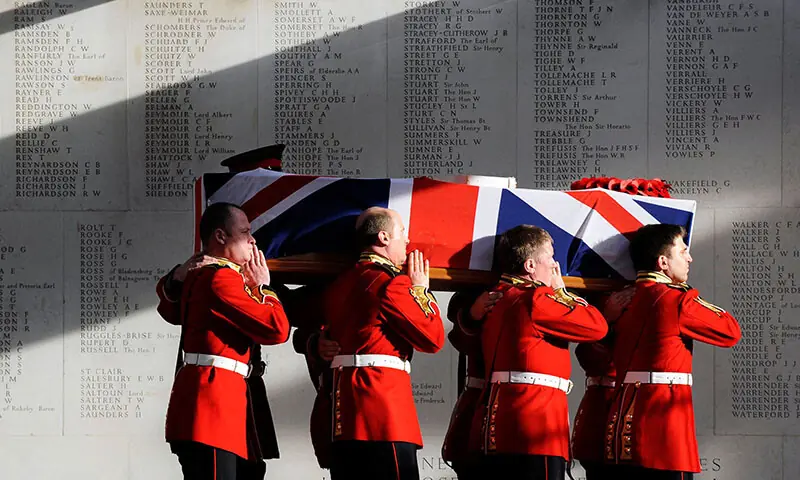 The coffin of Darren Chant, Regimental Sergeant Major, 1st Battalion Grenadier Guards, is carried out of the Royal Military Chapel at Wellington Barracks in London, the UK on December 1, 2009. &mdash; AFP/File