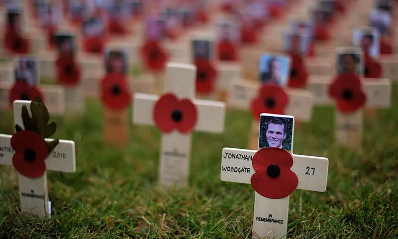 A cross of remembrance in memory of Lance Corporal of Horse, Jonathan Woodgate, from the Household Cavalry, laid by Britain&rsquo;s Prince Harry, is pictured after a ceremony to open first remembrance field dedicated solely to British military personnel who have been killed in Afghanistan since 2001, in Wootton Bassett, Wiltshire on November 9, 2010./ AFP)