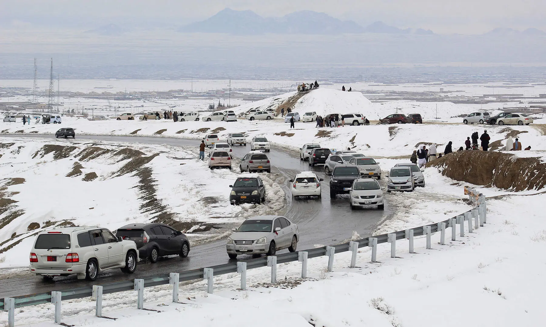 Commuters drive through a snow-covered road in Khyber Pakhtunkhwa&rsquo;s Chaman on January 22,. &mdash; AFP