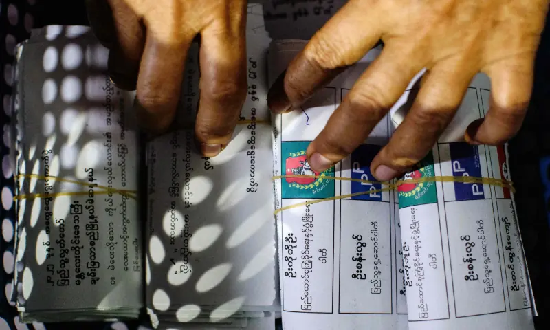 A box ticked for Union Solidarity and Development Party (USDP) (C) is seen amongst advance vote ballots as they are counted at a polling station after the close of voting for the third and final phase of Myanmar’s general election in Mandalay on Jan 25, 2026. — AFP